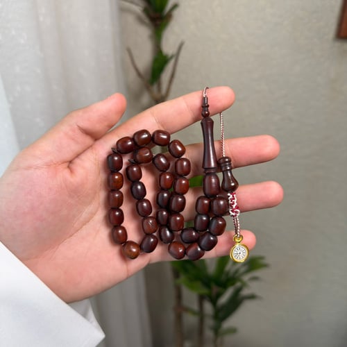 مسباح كوك بديزاين عقود يتميزُ بساعة أنيقة